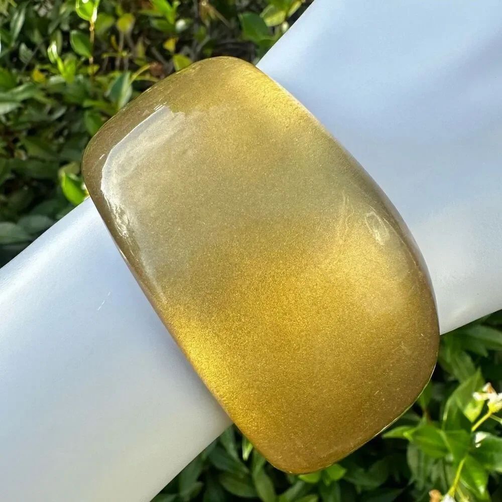 Gold tone lucite asymmetrical bangle bracelet